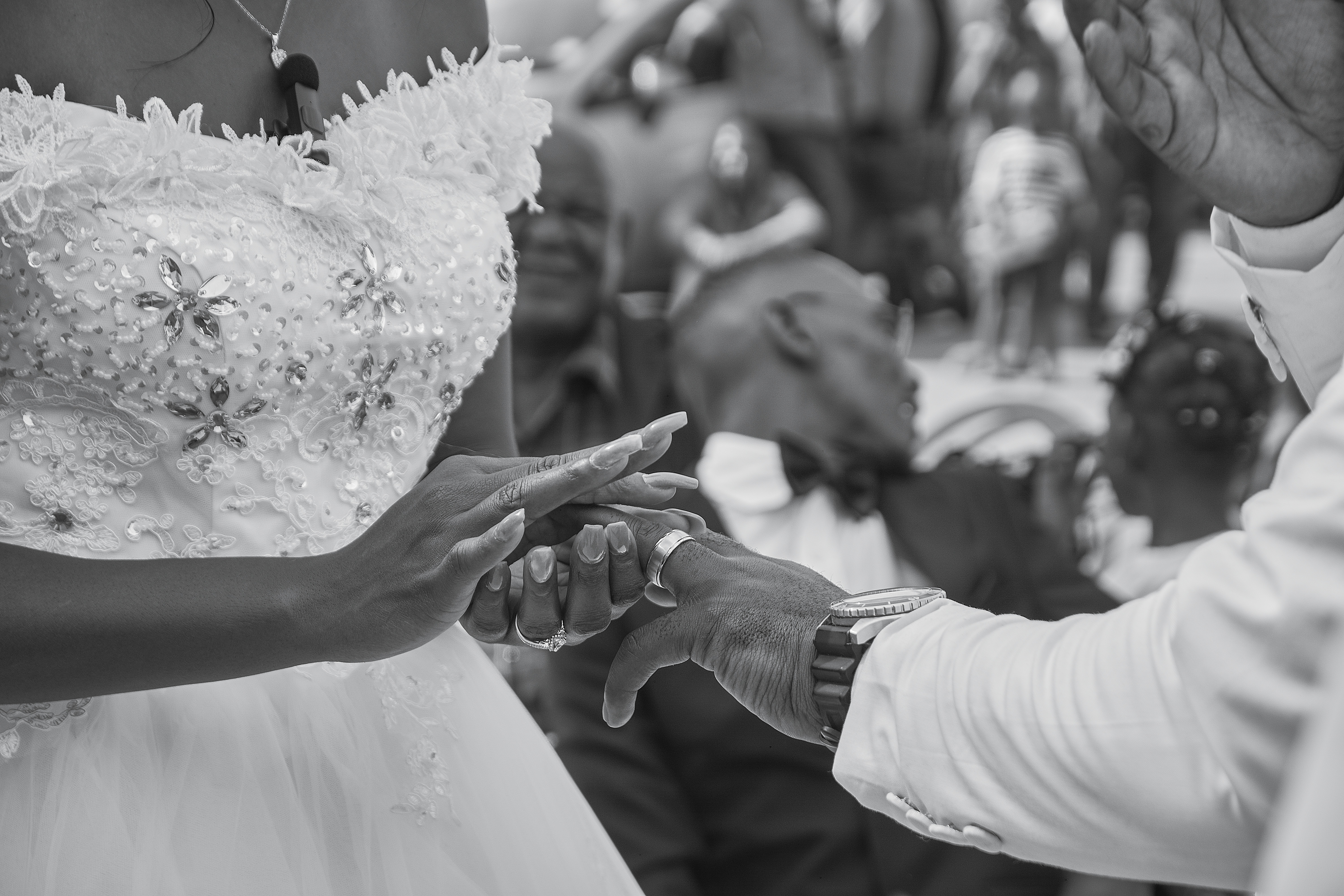 Bride and groom holding hands during an elegant wedding portrait